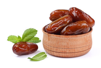 date fruit in wooden bowl isolated on white background