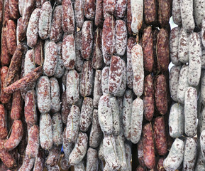 Italian different traditional sausages at the store.