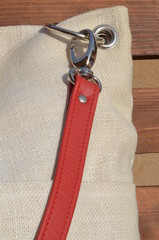 A white bag with red belt - closeup