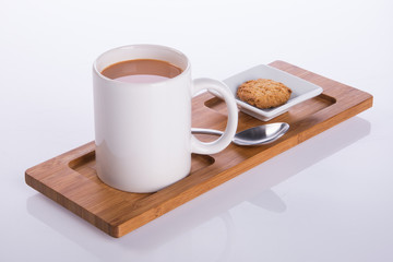 coffee or coffee with cookies on background.