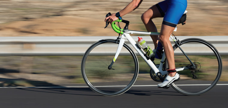 Motion blur of a bike race with the bicycle and rider at high speed