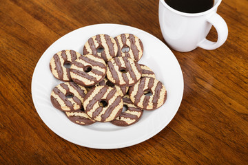 Fudge Striped Cookies on Plate with Coffee