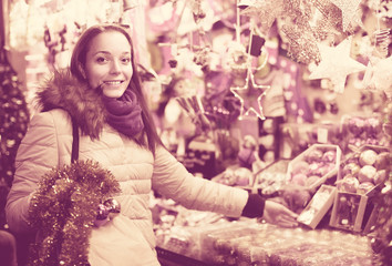 Woman at Christmas fair in evening.