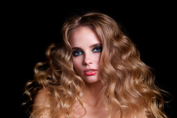Fototapeta premium Beauty Fashion Model Woman , portrait, hairstyle with creative hair-dress, curls waves. Concept Girl face with perfect skin in dark Background