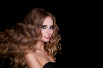 Naklejka premium Beauty Fashion Model Woman , portrait, hairstyle with creative hair-dress, curls waves. Concept Girl face with perfect skin in dark Background