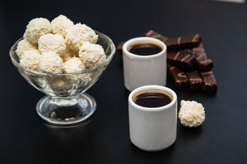 black coffee sweets on a black background