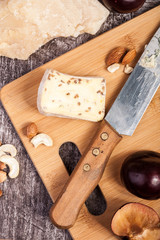 Healthy snaks from different type of cheese, nuts and plums. Healthy food. Snacks and products