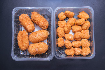 Raw meat Breaded meat in plastic boxes