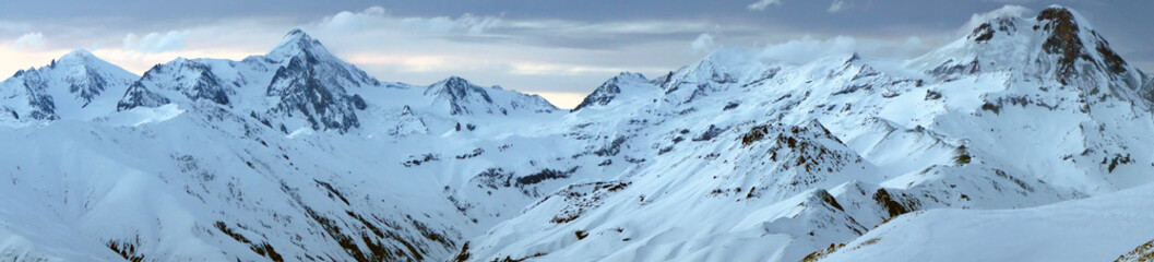 Panorama of the snow-capped mountains. the majestic mountains. Mountain kazbeg. Mount kazbek.
