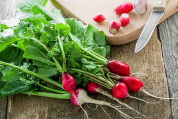 Fresh radish on a wooden table. Healthy home gardening organic harvest.