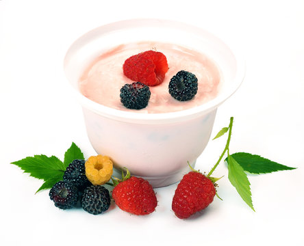 Yogurt in white plastic box with raspberry