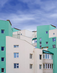 Photo of green white modern apartment building
