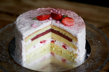 Strawberry yogurt cake.s Consists of butter sponge cakes,covered with cream-based live strawberry yoghurt. Filling : fresh strawberries and strawberry confit. Insanely light and delicate cake.
