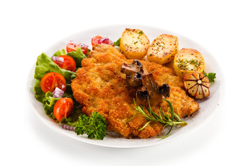 Fried pork chop with potatoes on white background