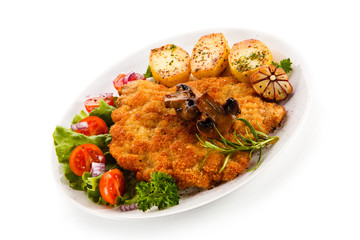Fried pork chop with potatoes on white background