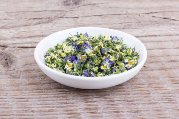 small, violet heartsease / Bowl of dried flowers from field pansy
