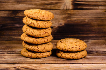 Stack of the oatmeal cookies on wooden table