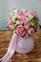 The bride's bouquet of soft pink peonies and white roses . Wedding floristry. Classic form