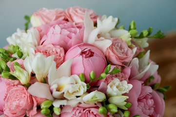 The bride's bouquet of soft pink peonies and white roses . Wedding floristry. Classic form