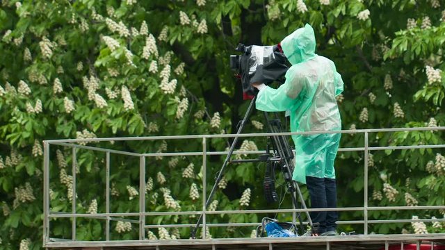 Man With Camera at rain