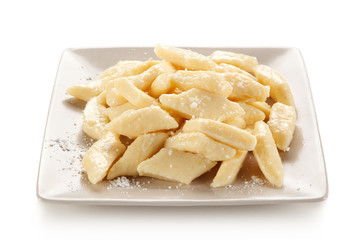 Potato noodles - dumplings on white background