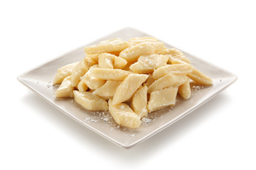 Potato noodles - dumplings on white background