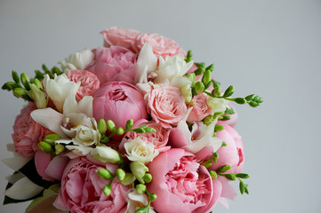 The bride's bouquet of soft pink peonies and white roses . Wedding floristry. Classic form