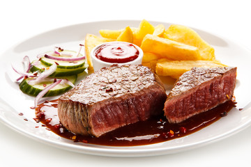 Grilled beefsteak with french fries on white background