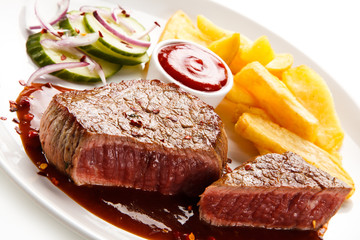 Grilled beefsteak with french fries on white background