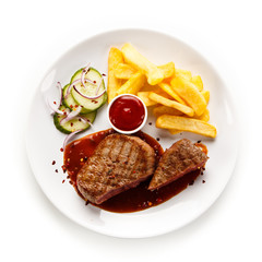 Grilled beefsteak with french fries on white background
