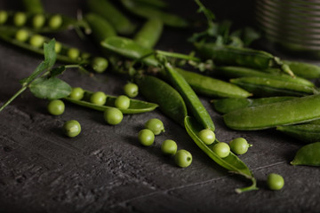 Green peas on a dark background