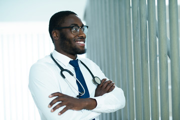 Doctor smiling - African American doctor posing