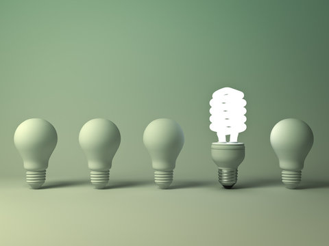 Eco energy saving light bulb, one glowing compact fluorescent lightbulb standing out from unlit incandescent bulbs on green background, individuality and different creative idea concept. 3D rendering.