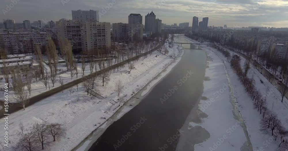 Wall mural aerial view on the town in eastern europe. winter season in city. urban landscape with different bui