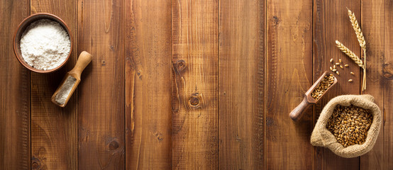 wheat grains on wooden background
