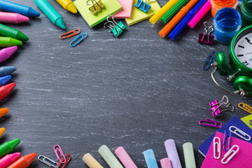 Assortment of school supplies, crayons, pens, chalks
