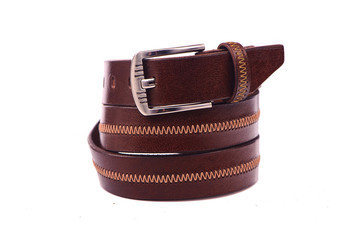 Belt male leather.The fashionable accessory is twisted on a white background.With a metal buckle.Natural animal skin.