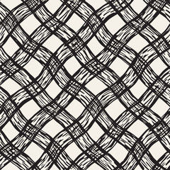 Hand drawn seamless plaid pattern. Allover pattern with ink doodle grunge grid. Graphic background with tartan.