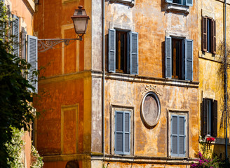 Fototapeta na wymiar Old colorful facade walls and windows, grunge architectural background