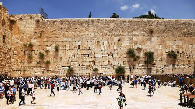 Western Wall or Wailing Wall or Kotel in Jerusalem timelapse. Plenty of people come to pray to the Jerusalem western wall. The Wall is the most sacred place for all jews on the planet.