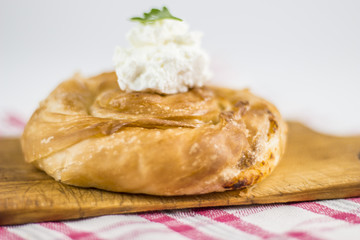 Cheese burek composition on white background