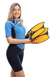 Young woman in a wetsuit with snorkeling equipment
