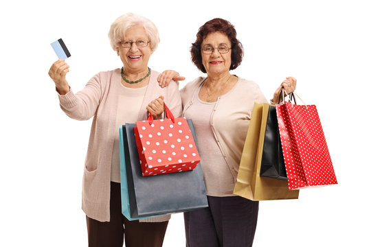 Two Elderly Women With Shopping Bags And A Credit Card