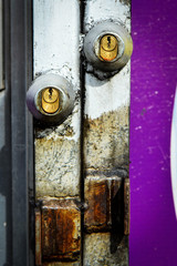 Two Locks with Purple Paint