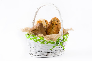 Mixed bread in basket isolated on white background
