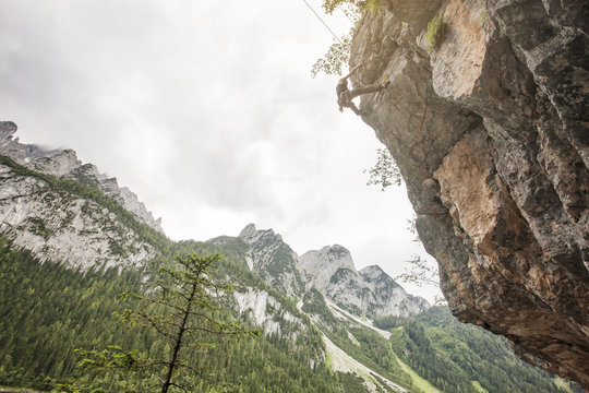 Landscape of Gosau Valley mountain with a male climber