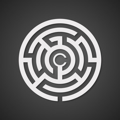 White round maze with shadow on a black background.