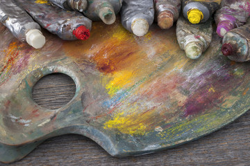 Artist's palette and tubes with paint