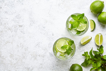 Mojito cocktail alcohol bar long drink traditional Cuba fresh tropical beverage top view copy space two highball glass - obrazy, fototapety, plakaty