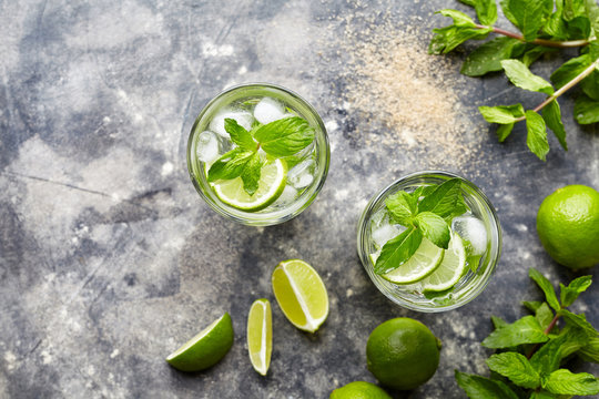 Mojito cocktail alcohol drink top view in highball glass, summer tropical vacation beverage with rum